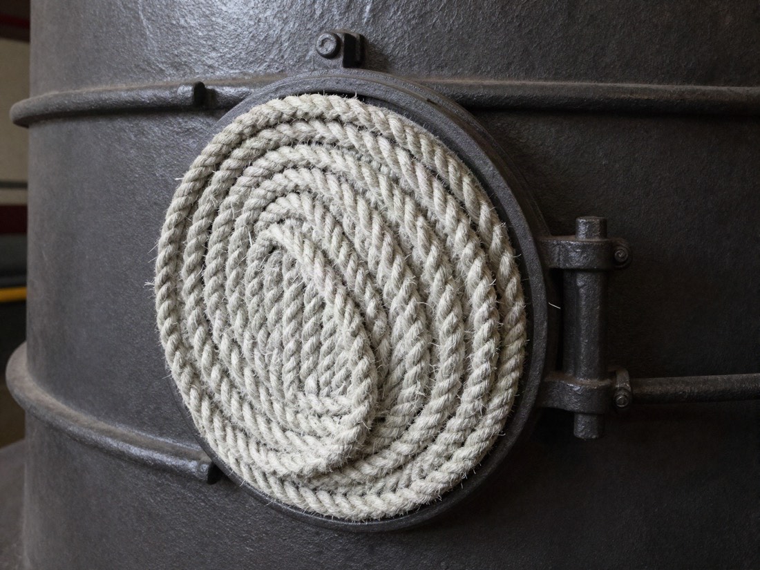 Woven rope gasket seal around an old cast iron boiler door
